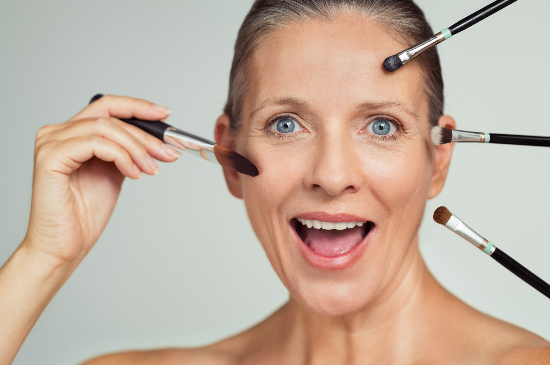 Woman with Makeup Brushes